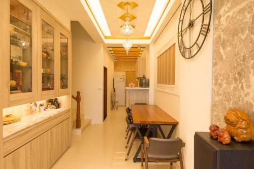 a kitchen with a table and a dining room at Miller Homestay in Wujie