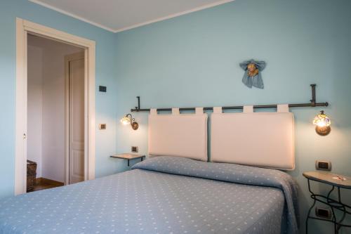 Ліжко або ліжка в номері Masseria Santa Lucia