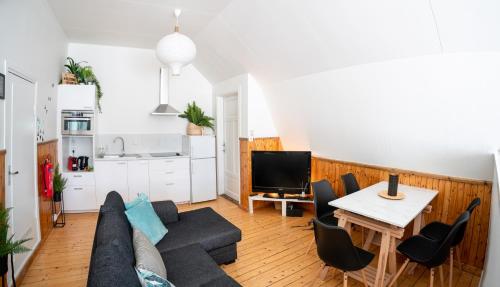 a living room with a couch and a table at The Mangevie in Furudal