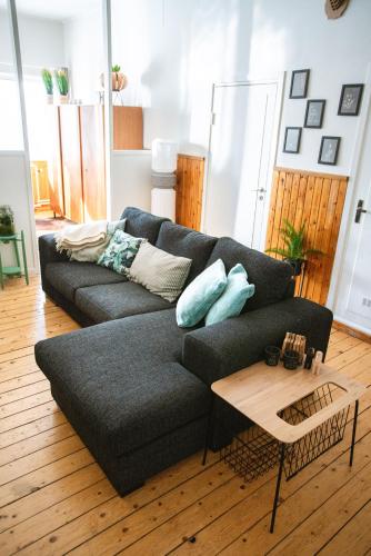 a living room with a couch and a table at The Mangevie in Furudal