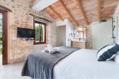 A bed or beds in a room at Hotel Turixant