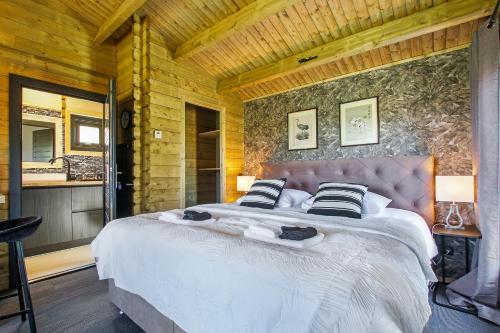 Postel nebo postele na pokoji v ubytování Appel Lodge