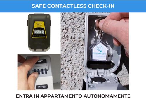 a close up of a key chain with a cell phone at Roggia Apartments by Quokka 360 - a stone's throw from Ciani Park in Lugano
