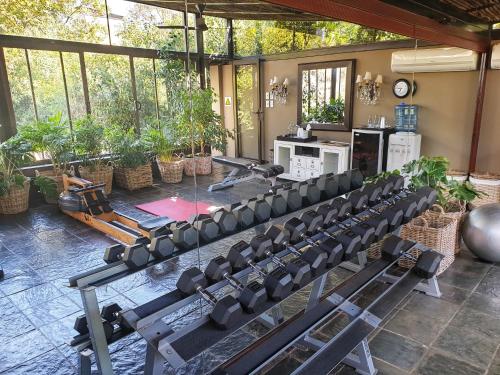 a room with a bunch of chairs in a gym at The Residence in Johannesburg