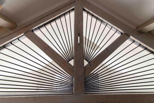 a large window with wooden blinds on it at Maébrilu Camargue Provence in Salin-de-Giraud