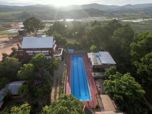 an overhead view of a swimming pool and a house at Villa ChezSoa, Antananarivo in Antananarivo