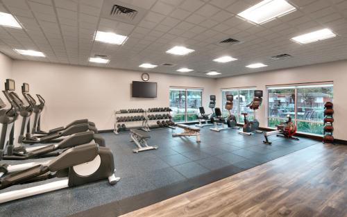 a gym with treadmills and machines in a room at Staybridge Suites - Gainesville I-75 by IHG in Gainesville