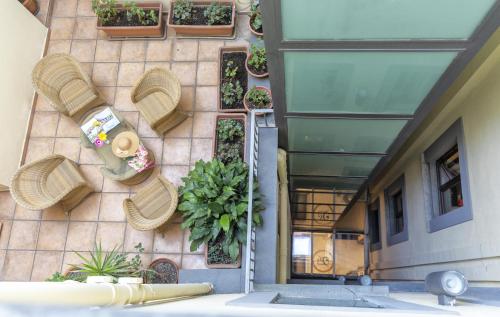 a building with potted plants on the side of it at Palazzo Turchini in Naples