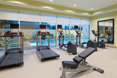 a gym with several treadmills and elliptical machines at Staybridge Suites - Miami International Airport by IHG in Miami