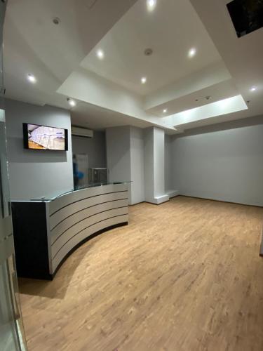 an empty room with a counter and a television on a wall at izZzleep WTC Mexico (world trade center Mexico) in Mexico City