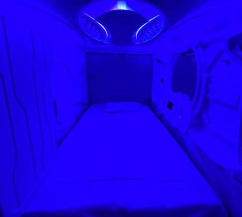 a blue light in the back of a vehicle at izZzleep WTC Mexico (world trade center Mexico) in Mexico City