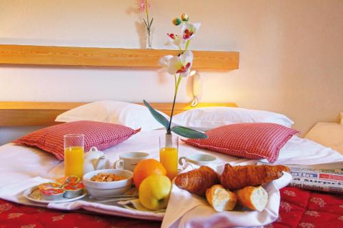 Ένα ή περισσότερα κρεβάτια σε δωμάτιο στο Hotel Grand Canyon du Verdon