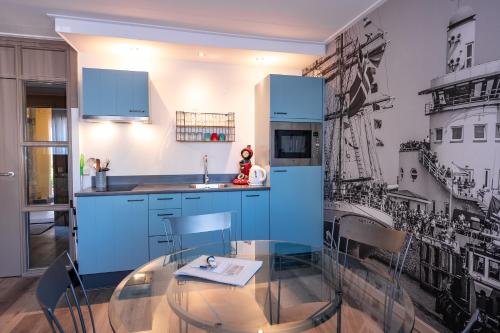 Кухня или мини-кухня в Hotel Almenum - het sfeervolle stadslogement -
