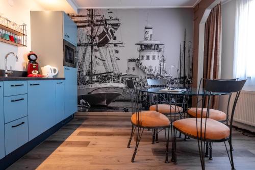 Кухня или мини-кухня в Hotel Almenum - het sfeervolle stadslogement -

