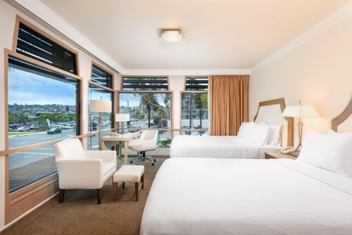 a hotel room with two beds and a window at DoubleTree by Hilton San Diego Bayside in San Diego