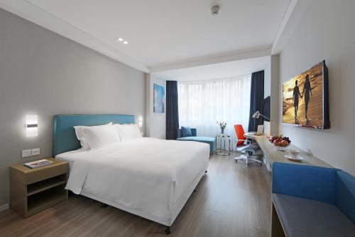 Postel nebo postele na pokoji v ubytování Holiday Inn Express - Xiamen City Center by IHG