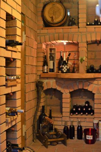 a brick fireplace with a clock on top of it at Cityhotel Ratheiser in Klagenfurt