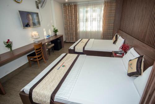 Katil atau katil-katil dalam bilik di Huynh Duc 2 Hotel