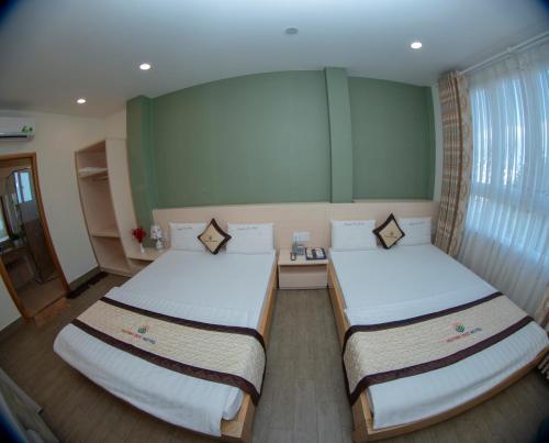 Katil atau katil-katil dalam bilik di Huynh Duc 2 Hotel