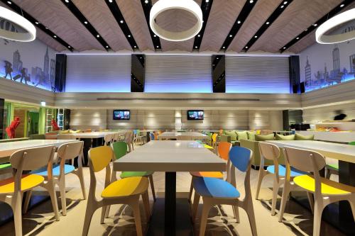a dining room with tables and chairs at Green World Hotel - Zhonghua in Taipei