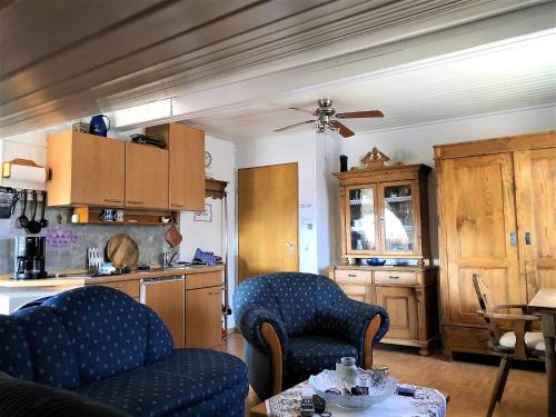 a kitchen with two chairs and a table in it at Ferienwohnung Boller II in Marktredwitz