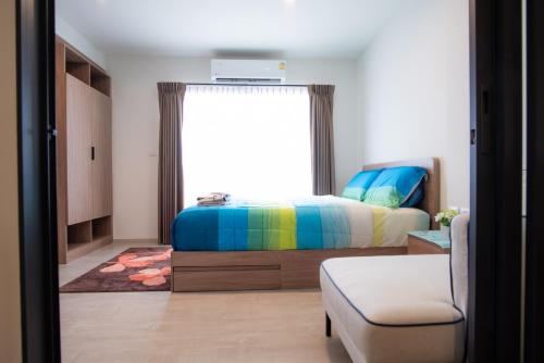En eller flere senge i et værelse på Lacasita484 In Huahin