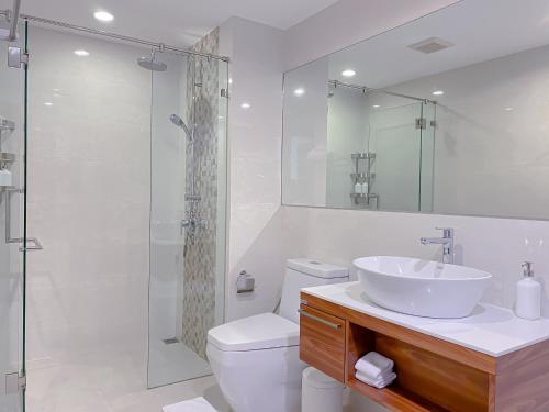 a bathroom with a sink and a toilet and a shower at Title Rawai Phase III by Beringela in Rawai Beach