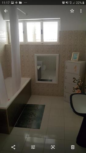 a bathroom with a sink and a mirror in it at Barko apartment and rooms in Hvar