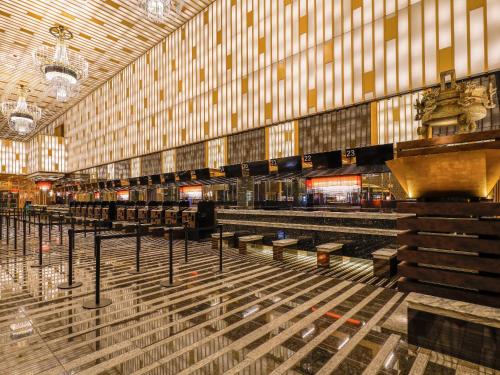 a large building with a row of benches in it at APA Hotel & Resort Yokohama Bay Tower in Yokohama