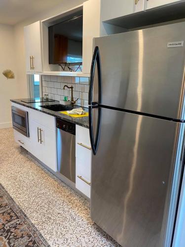 a large stainless steel refrigerator in a kitchen at Captiva Beach Resort (open private beach access) in Sarasota