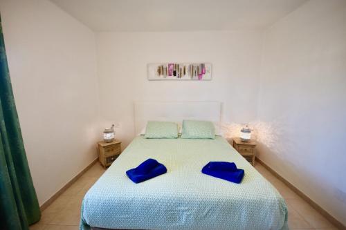 Кровать или кровати в номере Aloe