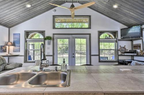 a kitchen with a sink and a ceiling fan at Floating Home on Columbia River with Provided Kayaks in Vancouver