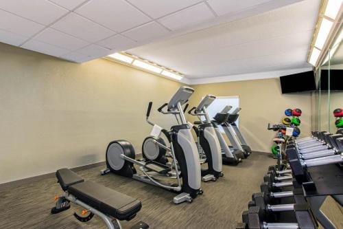 a gym with treadmills and elliptical machines at La Quinta Inn & Suites by Wyndham Panama City in Panama City