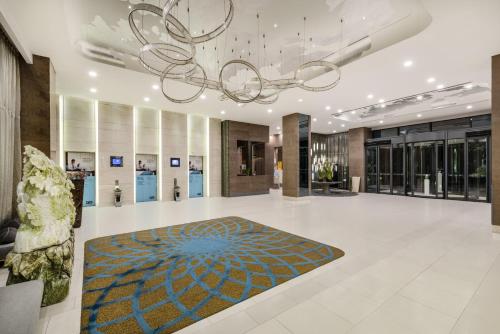 a lobby of a building with a chandelier at Holiday Inn Express Beijing Yizhuang by IHG - Taxi 1 Hour to International Airport and 800 Meters to the Nearby Subway in Daxing