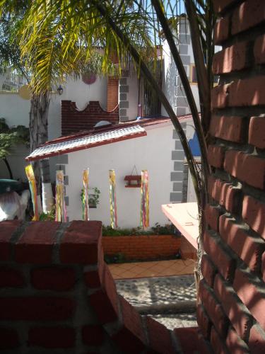 a brick wall in front of a house at Welcome To Casa OLE Playas de Tijuana 5-Rooms 14-Guests close to Shoping Center & Beach in Tijuana