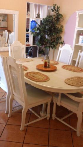 a table with white chairs and a potted tree on it at Welcome To Casa OLE Playas de Tijuana 5-Rooms 14-Guests close to Shoping Center & Beach in Tijuana