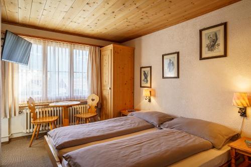 Ένα ή περισσότερα κρεβάτια σε δωμάτιο στο Hotel Silvapina