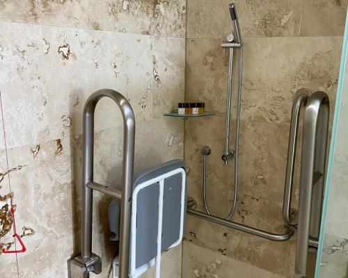 a shower stall in a bathroom with a toilet at The Carpenters Arms in Thirsk