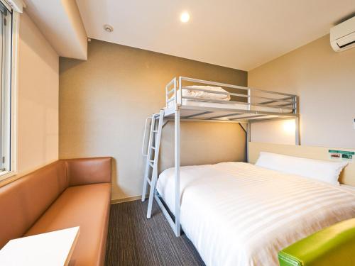Ένα ή περισσότερα κρεβάτια σε δωμάτιο στο Super Hotel Kashima