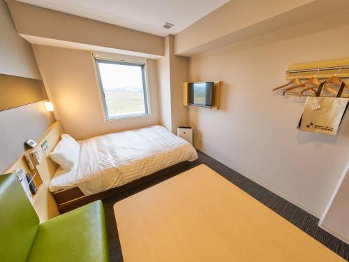 Ένα ή περισσότερα κρεβάτια σε δωμάτιο στο Super Hotel Kashima