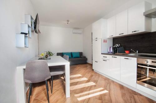 Η κουζίνα ή μικρή κουζίνα στο Apartments Escape