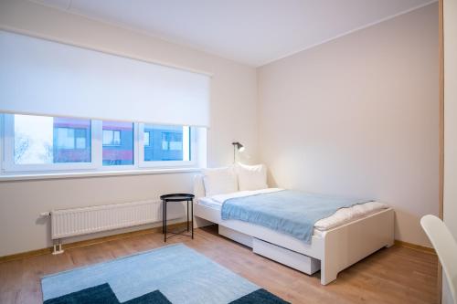 Katil atau katil-katil dalam bilik di Spacious Mustamäe Apartments - Free parking