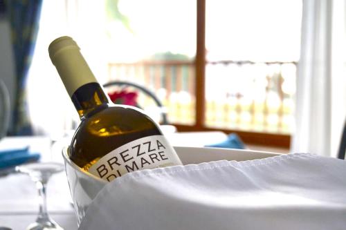a bottle of wine sitting on a table at Residence Antigua in Bonifati