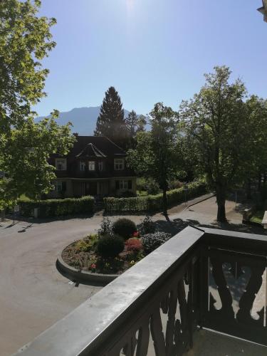 a house with a bridge in front of a garden at Villa Steiermark in Bad Reichenhall