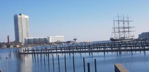 a dock with a boat on top of the water at FeWo Tina in Lübeck