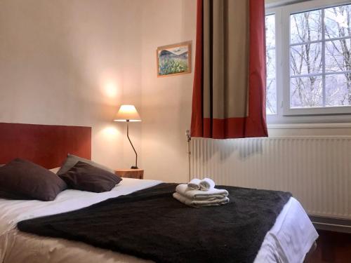 Postel nebo postele na pokoji v ubytování Maison d'hoursentut