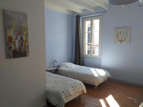 מיטה או מיטות בחדר ב-Auberge des chemins