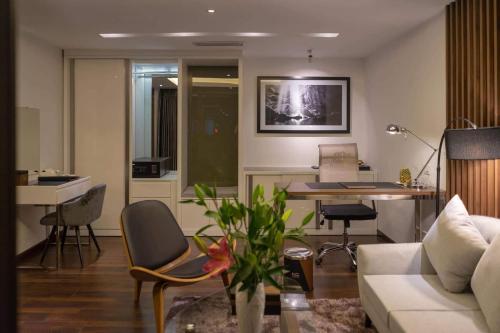 a living room with a couch and a table at KP Hotel in Can Tho