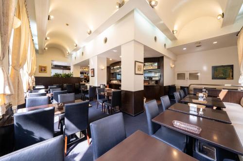 a dining room with tables and chairs in a restaurant at Hotel Sunlite Shinjuku in Tokyo