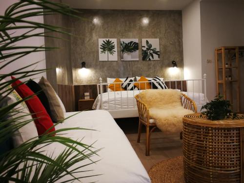 Ένα ή περισσότερα κρεβάτια σε δωμάτιο στο baankorrakang